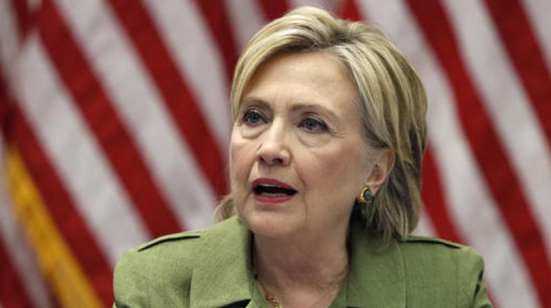 Democratic presidential candidate Hillary Clinton talks with media as she meets with law enforcement leaders at John Jay College of Criminal Justice in New York