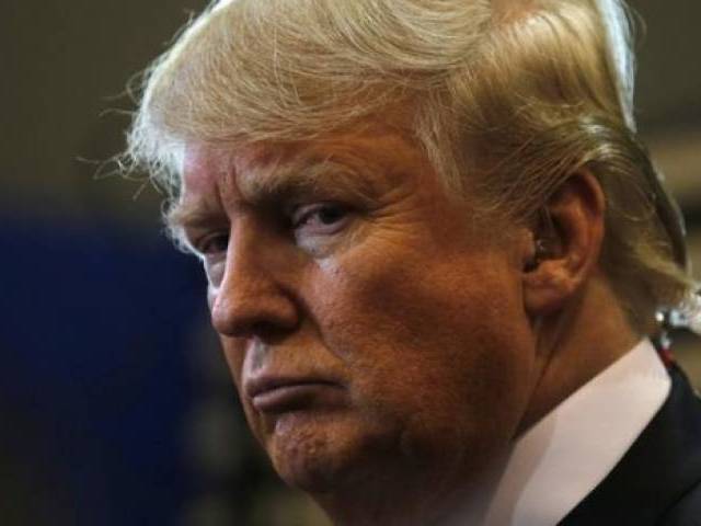 Republican US presidential candidate Donald Trump talks to the media in the'spin room after the Republican US presidential candidates debate sponsored by ABC News at Saint Anselm College in Manchester New Hampshire