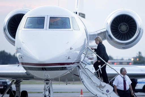 Democratic presidential candidate Hillary Clinton boards a plane at Chicago Midway International Airport in Chicago Thursday Aug. 11 2016 to travel to Westchester N.Y. Clinton gave a speech on the economy after touring Futuramic Tool & Engineering