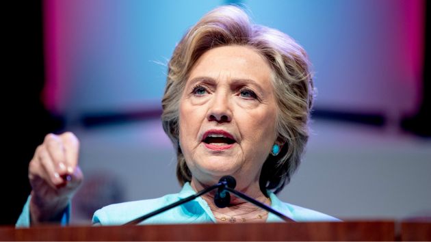 Clinton speaks at the joint convention for national associations of black and Hispanic journalists on Friday. Andrew Karnik  AP