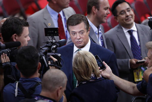 Trump Campaign Chairman Paul Manafort is surrounded by reporters on the floor of the Republican National Convention in Cleveland