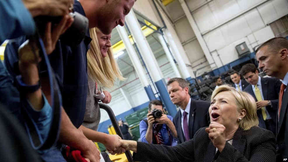 Democratic presidential candidate Hillary Clinton reacts while greeting supporters after giving a speech on the economy at Futuramic Tool & Engineering in Warren Mich. Aug. 11 2016./VOA CREDIT