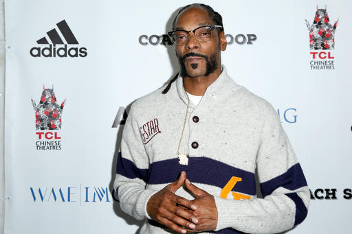 Snoop Dogg arrives at the LA Premiere of'Coach Snoop at the TCL Chinese 6 Theatres in Los Angeles. Authorities say multiple people have been hurt after a railing collapsed during an outdoor concert by Snoop Dogg and Wiz