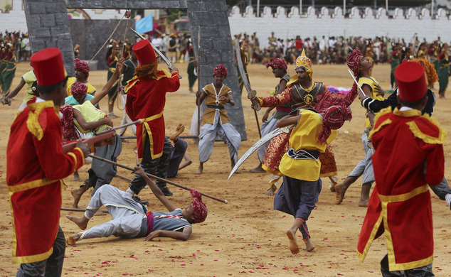 School children enact a scene of India's pre-independence era during Independence Day celebrations in Bangalore India Monday Aug. 15 2016. India gained