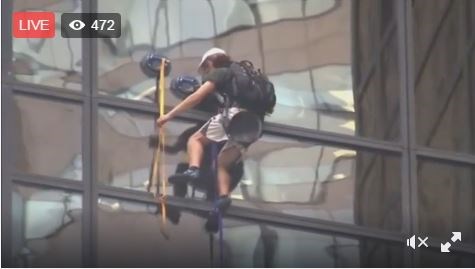 WATCH: Man Trying to Scale Trump Tower, Cops Await