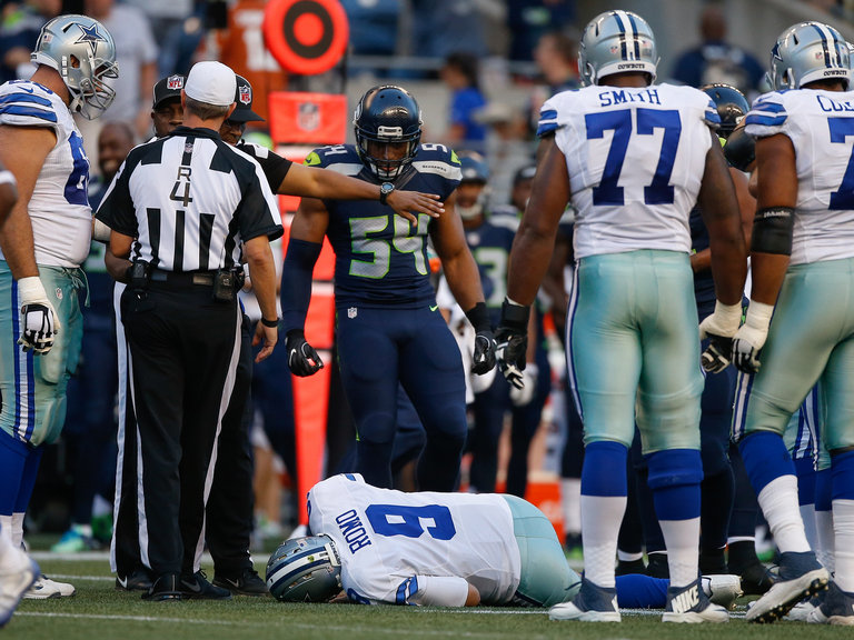 Dallas quarterback Tony Romo lies injured against Seattle