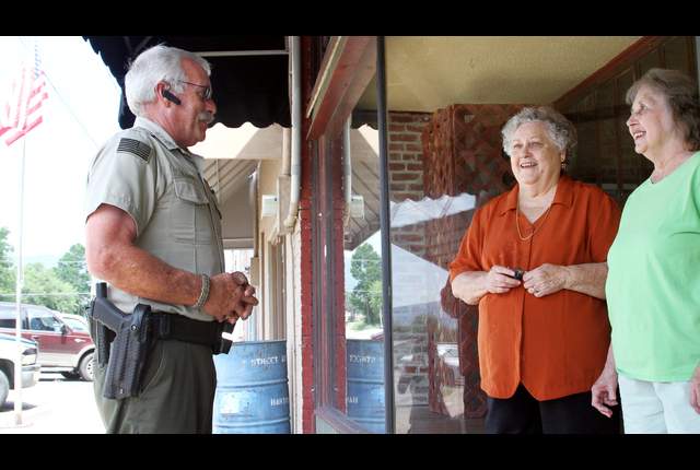 Cpl. Bill Cooper is seen here talking to residents in Hartford