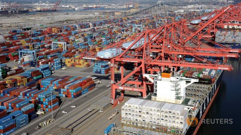 Cranes and containers are seen at the Ports of Los Angeles and Long Beach California