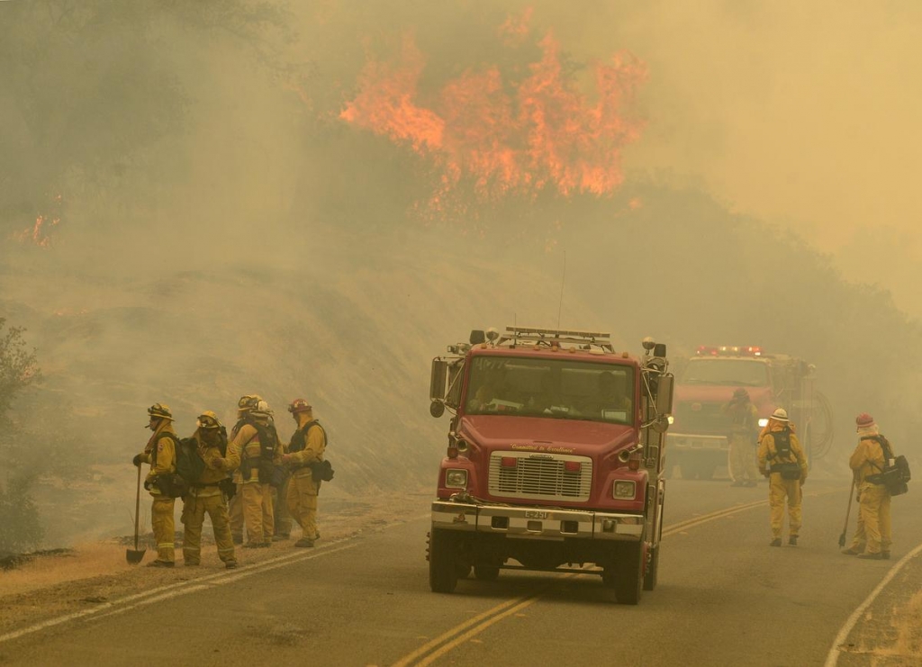 In dry, windy West, crews target flames in several states