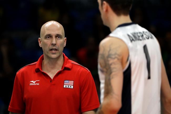 United States head coach John Speraw speaks with Matthew Anderson during a men's preliminary volleyball match against France at the 2016 Summer Olympics in Rio de Janeiro Brazil Saturday Aug. 13 2016