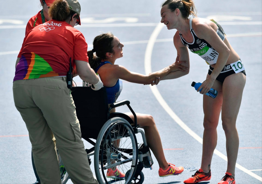 Olympic dreams dashed, two runners help each other to the finish