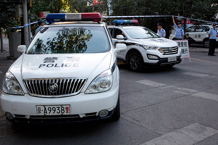 Chinese police vehicles are seen in this