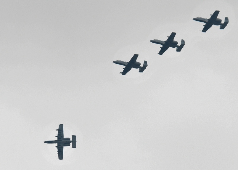 Four A-10 Thunderbolt IIs fly in formation over Osan Air Base Republic of Korea Aug. 23 2016. The A-10s all assigned to the 25th Fighter Squadron return to base after flying a training sortie and will continue flying sorties all week as part of Exer