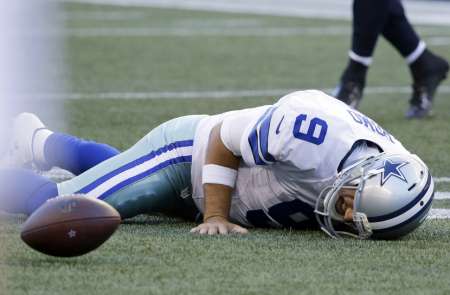 Tony Romo has broken bone in back