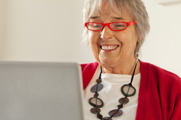 Elderley woman using a laptop computer