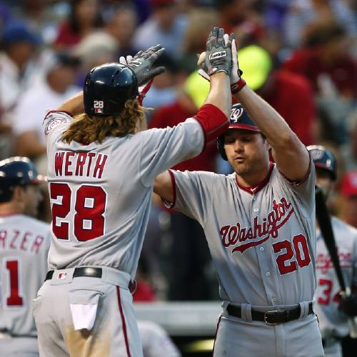 Jayson Werth is congratulated by teammate Daniel Murphy after hitting a two run home run off Colorado Rockies starting pitcher Jorge De La Rosa during the third inning of a baseball game Monday Aug. 15 2016 in D