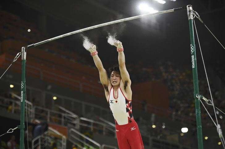 2016 Rio Olympics- Artistic Gymnastics- Preliminary- Men's Qualification- Subdivisions- Rio Olympic Arena- Rio de Janeiro Brazil- 06/08/2016. Kohei Uchimura of Japan falls as he competes on the horizontal bar. REUTERS  Dylan Martinez