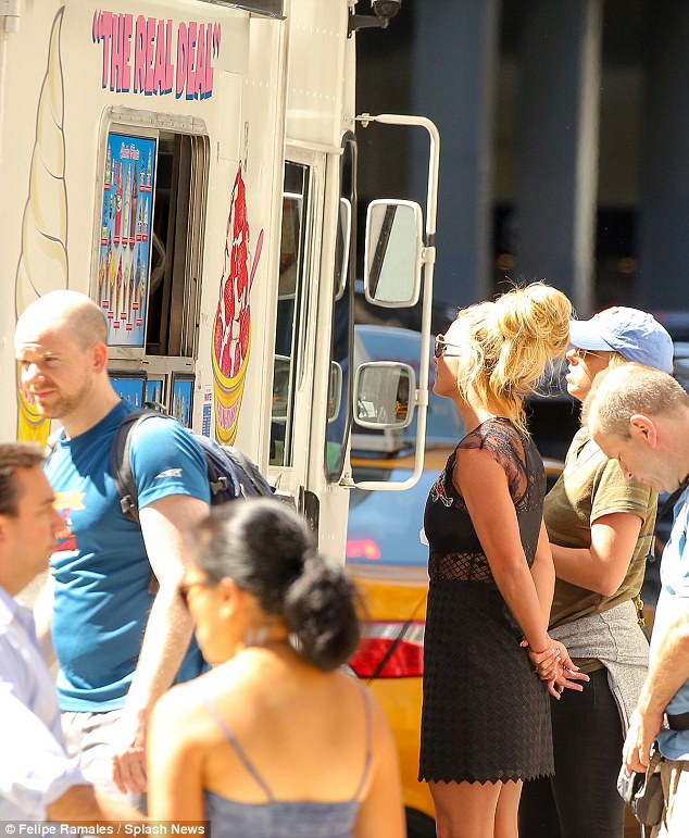 Decisions decisions The singer appeared to ponder the selection of ice-creams before opting for a cone