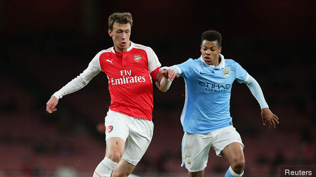 Arsenal's Krystian Bielik and Manchester City's Lukas Nmecha in action