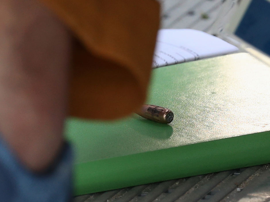 A bullet is seen inside the media centre at the Olympic Equestrian Centre after it went through the wall of the media centre during competition in the Individual Dressage event