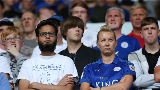 Dejected Leicester City fans look on as the defending champions lose to Hull City in the Premier League opener on Saturday