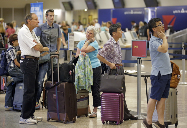 Delta passengers stand in line as the carrier slogged through day two of its recovery from a global computer outage Tuesday Aug. 9 2016 in Salt Lake City