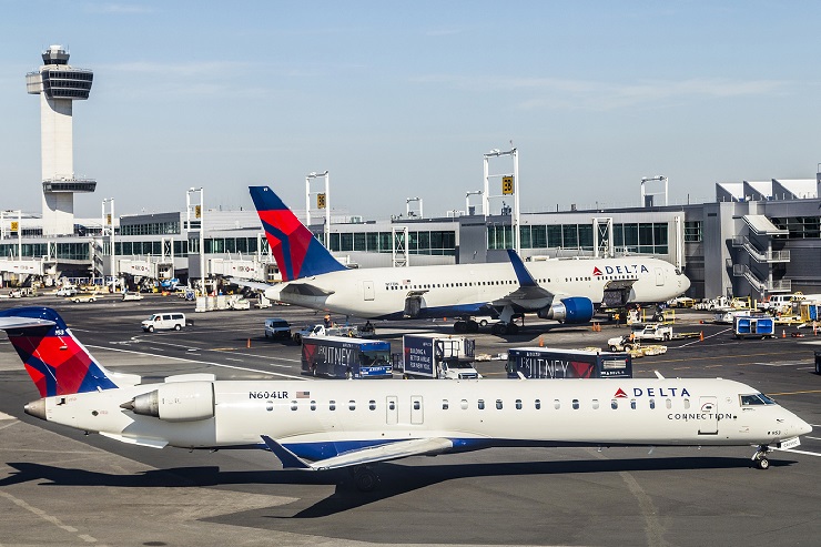 Air Traffic Control Tower And Terminal 4 With Air Planes At The