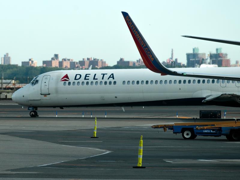 A Delta jet taxis on the tarmac at New York's La Guardia Airport. About 1,000 Delta flights around the globe were canceled Monday and hundreds more on Tuesday after a system outage