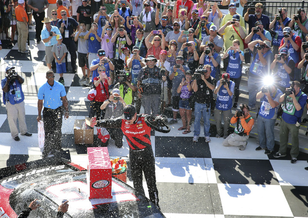 Joey Logano celebrates in Victory Lane after winning the NASCAR Xfinity series auto race at Watkins Glen International Saturday Aug. 6 2016 in Watki