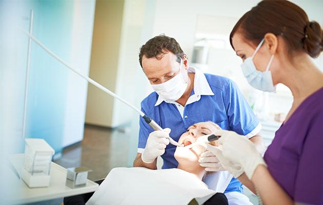 Dentists still advise patients to floss to prevent gum disease