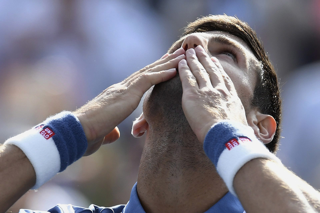 Novak Djokovic of Serbia celebrates his win over Kei Nishikori of Japan during the men's final of the Rogers Cup tennis tournament Sunday