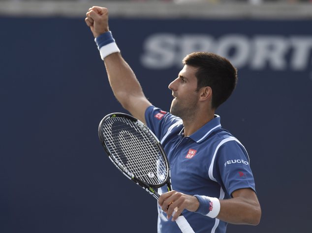 Novak Djokovic of Serbia celebrates his win over Kei Nishikori of Japan during the men's final of the Rogers Cup tennis tournament Sunday