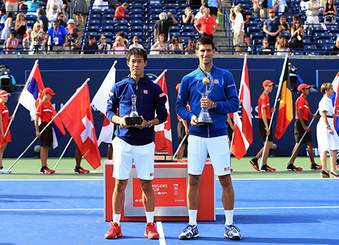 TORONTO ON- JULY 31 Novak Djokovic of Serbia with the winners trophy and Kei Nishikori of Japan with the runners-up trophy following the Singles Final during Day 7 of the Rogers Cup at the Aviva Centre