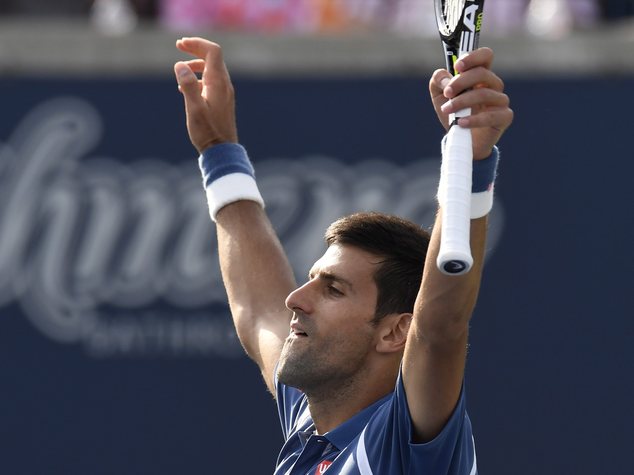 Novak Djokovic of Serbia celebrates his win over Kei Nishikori of Japan during the men's final of the Rogers Cup tennis tournament Sunday