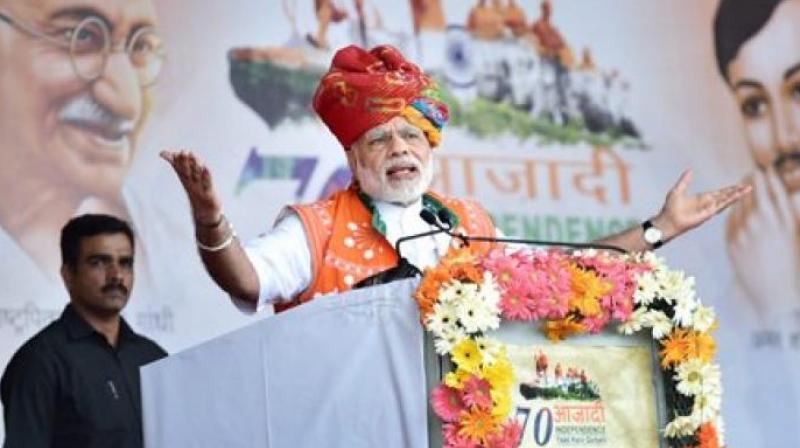 Prime Minister Narendra Modi addresses the public meeting to mark launch of 70th Freedom Year Celebrations in Bhabra village Alirajpur district on Tuesday