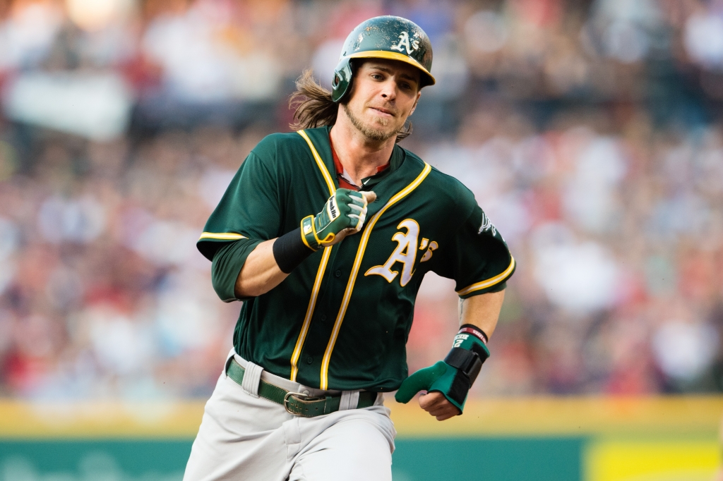 CLEVELAND OH- JULY 30 Josh Reddick #22 of the Oakland Athletics rounds second on his way to third off a hit by Danny Valencia #26 during the first inning against the Cleveland Indians at Progressive Field