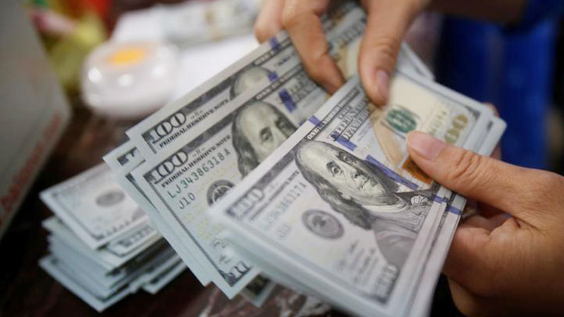 Dollar edges up but on track for weekly loss