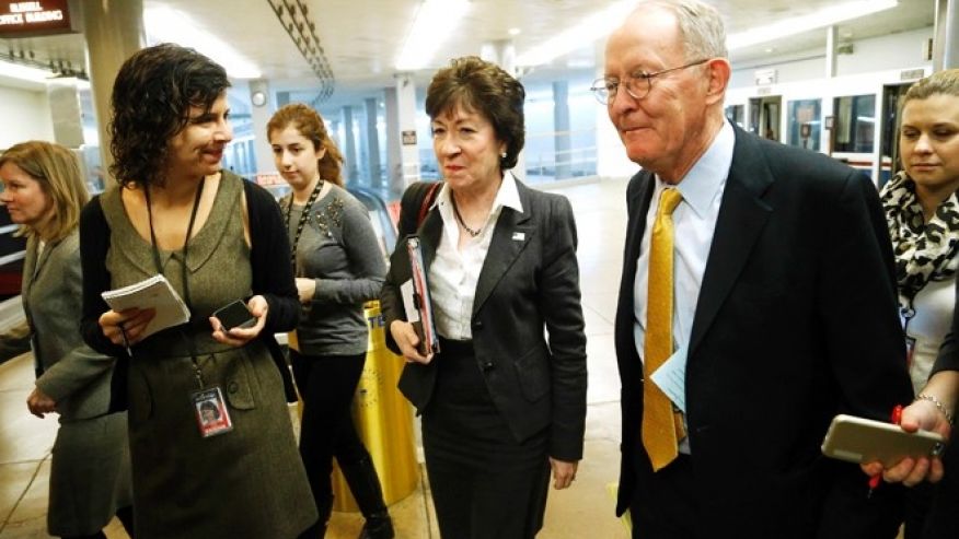 U.S. Senator Susan Collins  and Senator Lamar Alexander  are greeted reporters as they arrive for the weekly Senate Republican caucus luncheon at the U.S. Capitol in Washingt