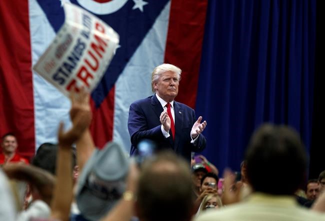 Republican presidential candidate Donald Trump applauds after speaking during a town hall event Monday Aug. 1 2016 in Columbus Ohio