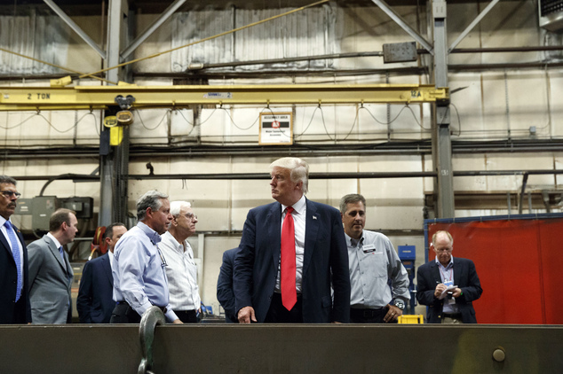 Republican presidential candidate Donald Trump takes a tour of Mc Lanahan Corporation headquarters a company that manuf