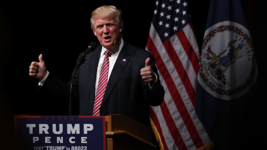 Donald Trump holds two thumbs up during a campaign event at Briar Woods High School