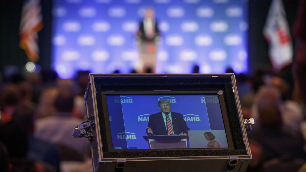 Republican presidential candidate Donald Trump is captured in a video monitor as he speaks to the National Association of Home Builders Thursday Aug. 11 2016 in Miami Beach Florida