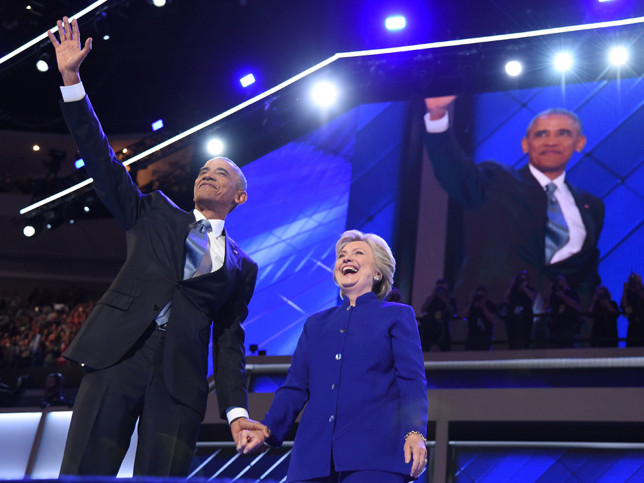 President Barack Obama waves with Presidential nominee Hillary Clinton during the third night of the Democratic National Convention. The party's focus on issues of social equality might be alienating white men critics say