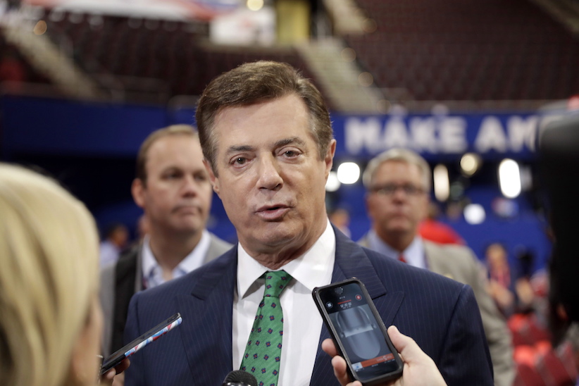 Trump Campaign Chairman Paul Manafort talks to reporters on the floor of the Republican National Convention at Quicken Loans Arena Sunday