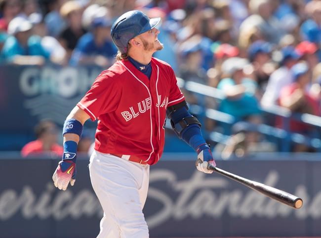 Toronto Blue Jays&#039 Josh Donaldson watches his second home run leave the park in the seventh inning of their American League MLB baseball game against the Minnesota Twins in Toronto Sunday