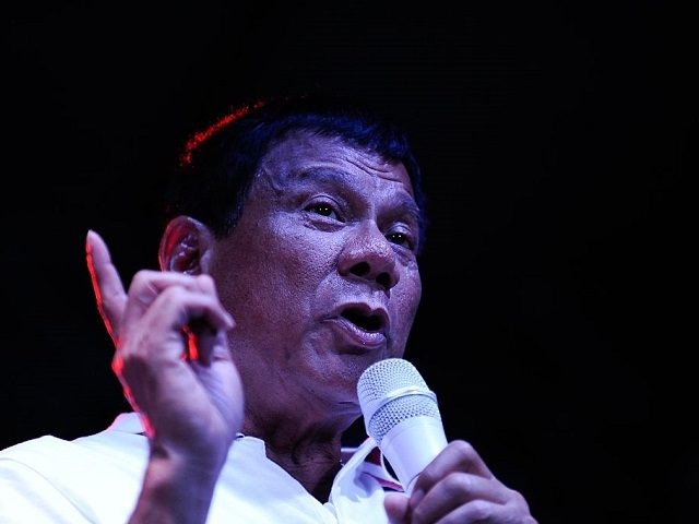 MANILA PHILIPPINES- MAY 01 Philippine presidential candidate Rodrigo Duterte gestures during a labor day campaign rally