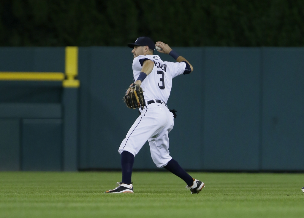 DETROIT MI- AUGUST 16 Second baseman Ian Kinsler #3 of the Detroit Tigers throws out Alcides Escobar #2 of the Kansas City Royals at third base on a force out during the eighth inning at Comerica Park