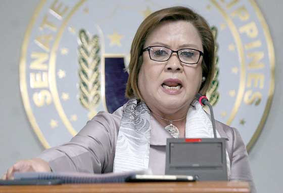 BELEAGUERED Senator Leila de Lima reads a prepared statement before the press at the Senate appealing to President Rodrigo Duterte to let her defend herself against his allegations that she took money from drug syndicates through her loverdriver. De Lima