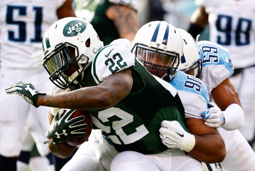 Stevan Ridley #22 of the New York Jets tries to avoid the tackle of the Tennessee Titans in the first quarter during their game at Met Life Stadium