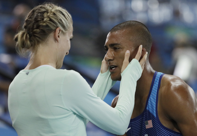 ASSOCIATED PRESS           United States’ Ashton Eaton embraces his wife Canada’s Brianne Theisen Eaton after winning the gold medal in men’s decathlon during the athletics competitions of the 2016 Summer Olympics at the Olympi